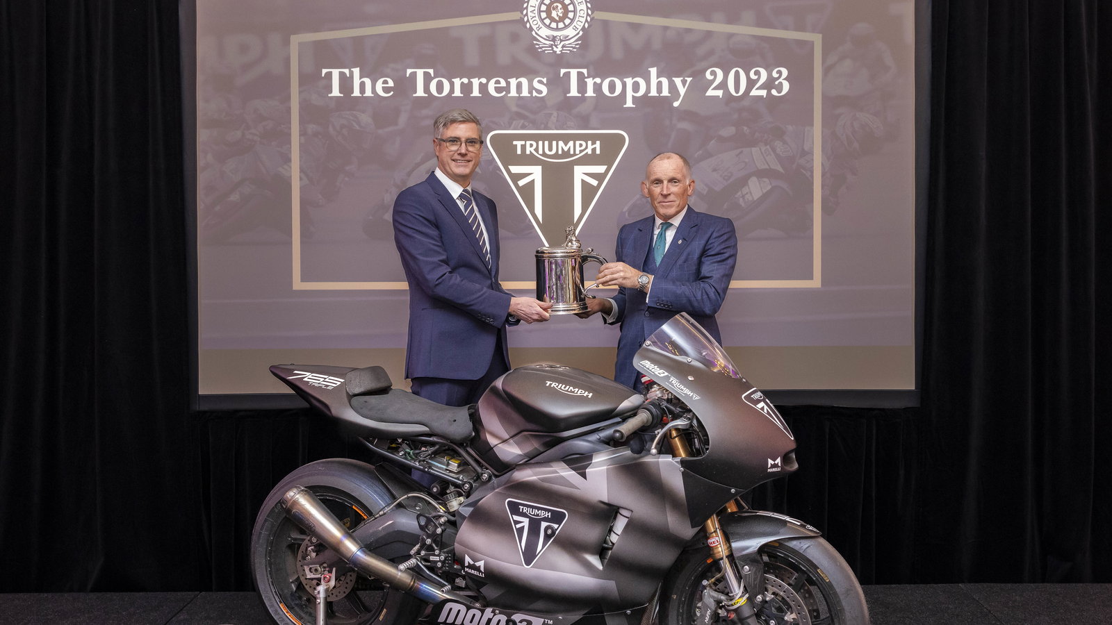 Nick Bloor, CEO Triumph Motorcycles being presented with Royal Automobile Club Torrens Trophy by Ben Cussons, Chairman of the Royal Automobile Club